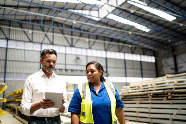 istock Manager and employee talking in a factory/industry 1363139889