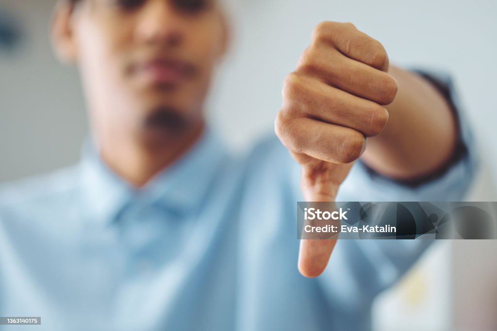 Hand sign Thumbs Down Stock Photo