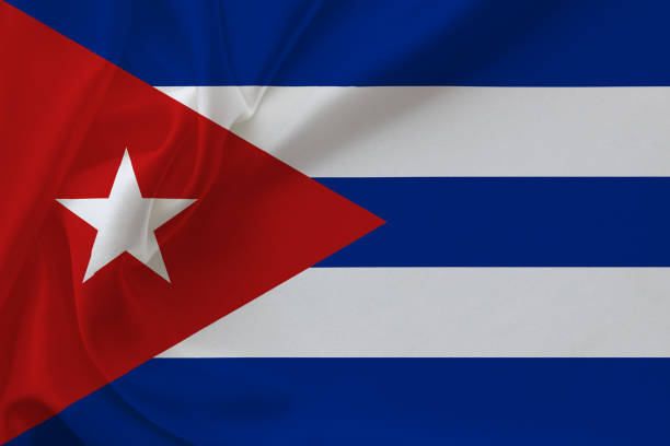 istock Cuba flag on waving silk background 1363141196