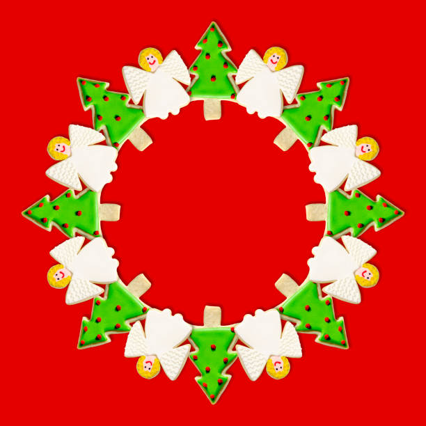 Christmas Tree and Angel: A Christmas Wreath has been created using festive decoratively iced Christmas Cookies