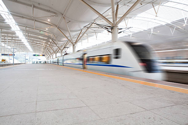 istock High speed train fast passing station with motion blur. 136314216