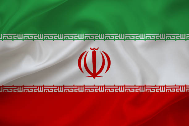 istock Iran flag on waving silk background 1363142745
