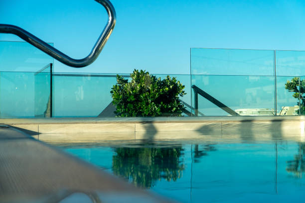 istock Swimming pool with clear blue skies 1363142786