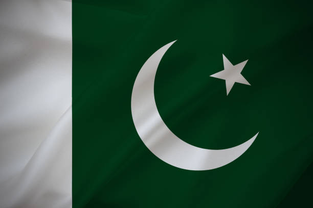 istock Pakistan national flag on waving silk background 1363142862