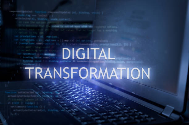 istock Digital transformation inscription against laptop and code background. 1363143915