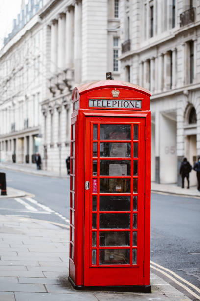 istock Classic British red colored pay telephone booths in London 1363146591