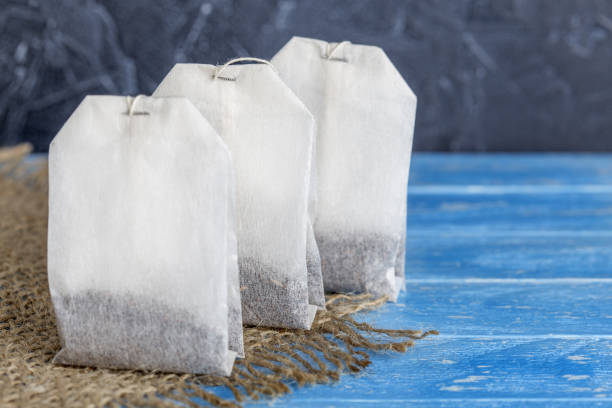 tea bag with herbs for tea on wooden table