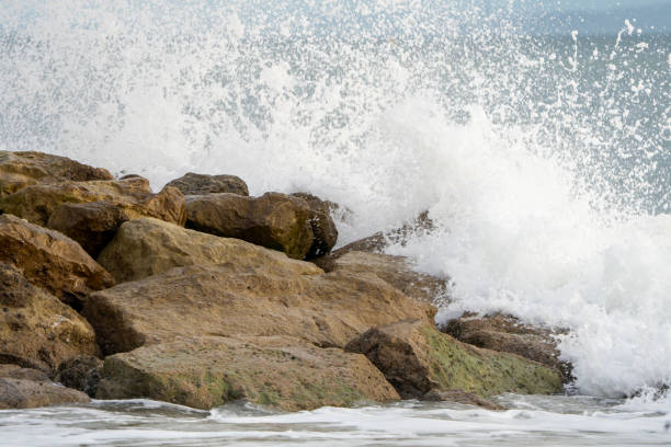 istock Sea Waves Crashing Over Sea Groyne 1363150022