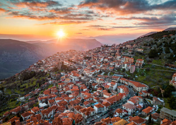 Aerial sunset view of the mountain village Arachova Aerial view of the mountain village Arachova, Boiotia, Greece, during a beautiful winter sunset arachova greece stock pictures, royalty-free photos & images