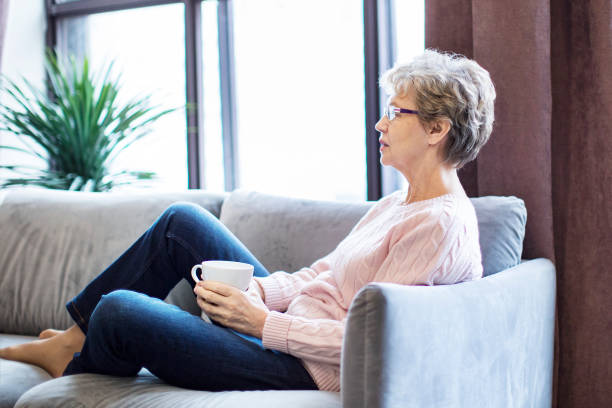 istock Active senior female drinking tea at home 1363156265