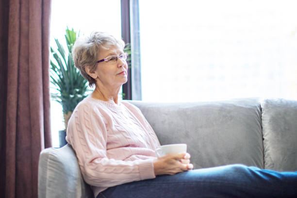 istock Active senior female drinking tea at home 1363156274