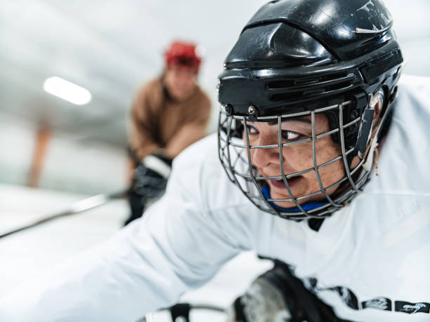 istock Latin woman and her trainer practising para hockey 1363157698