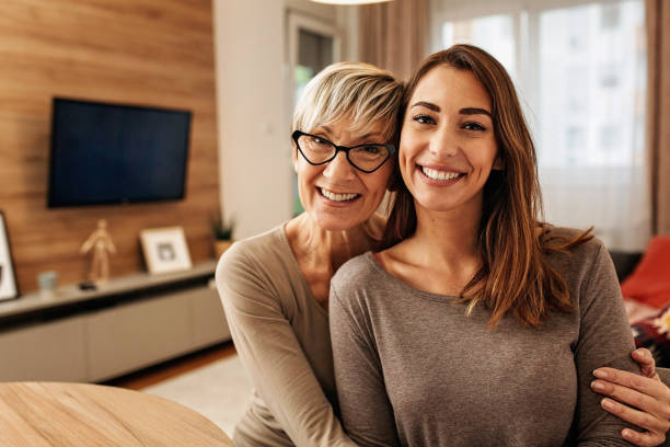 Portrait of a Caucasian mother and daughter bonding at home stock photo