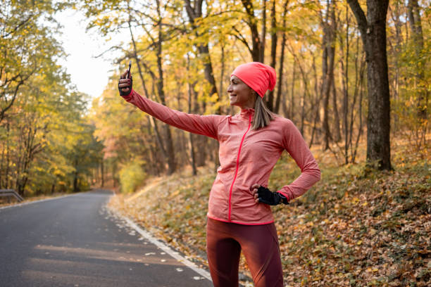 istock Middle aged Caucasian woman getting ready for her daily jogging routine 1363167255