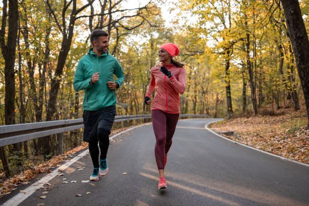 istock Happy Caucasian couple jogging in nature 1363167430