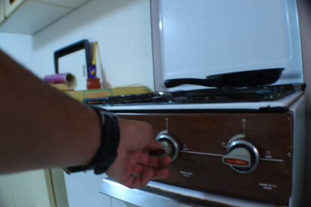 istock setting up the fire by turning on the stove 1363168023