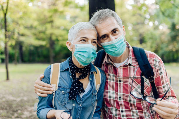 istock Couple wear surgical masks 1363168552
