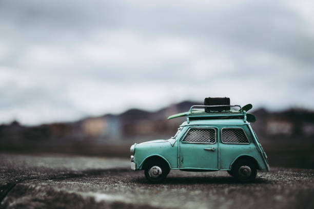 istock Outdoor background with green miniature car 1363176412