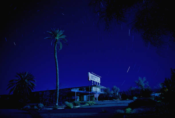 Motel at Salton Sea at night 2 photo series of a motel at the Salton Sea. Tungsten slide film and medium format film cameras were used. Notice star trails. abandoned place stock pictures, royalty-free photos & images