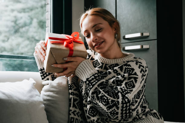istock excited woman holding gift box 1363183075