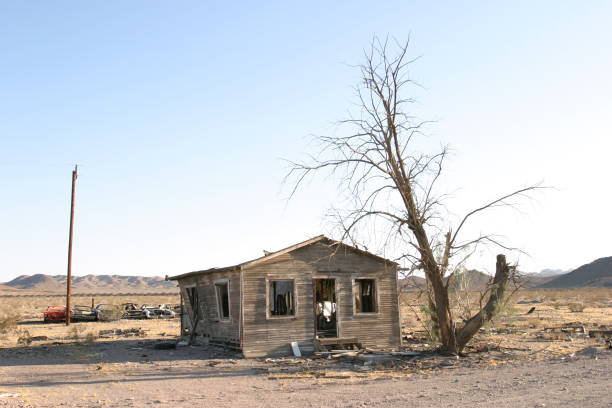 istock Abandoned house with cars 1363183936