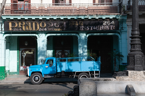 Old Soviet Union truck parked in front of a restaurant bar on Paseo del Prado avenue in Old Havana. Havana. Cuba. May 12, 2015