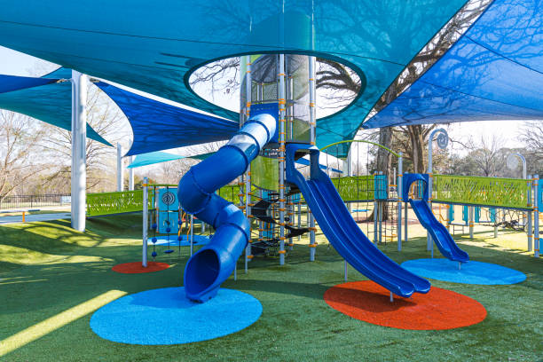 istock Modern playground with slides, bridges, and canopy 1363188289