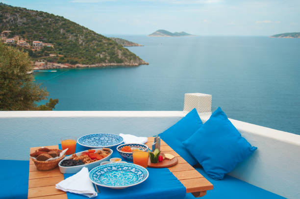 Healthy food table setting for two. Blue view. Healthy and colorful mediterranean diet meal