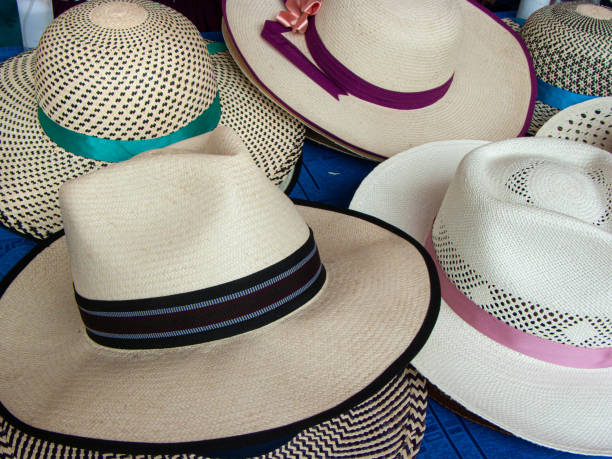 Authentic handmade straw Panama Hats form Ecuador Authentic handmade straw Panama Hats or Paja Toquilla hats or sombreros at the traditional outdoor market in Cuenca, Ecuador. Popular souvenir from South America cuenca ecuador stock pictures, royalty-free photos & images