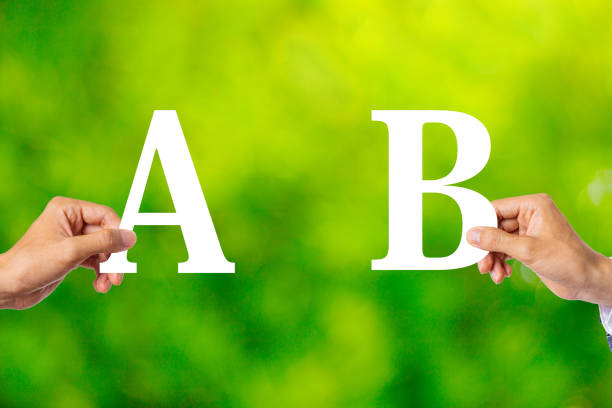 istock Alphabet A and B comparison and green blur background 1363190968