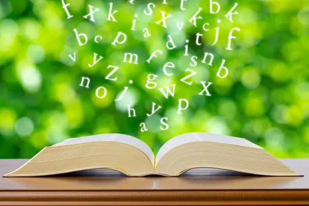 Alphabet and green blur background
