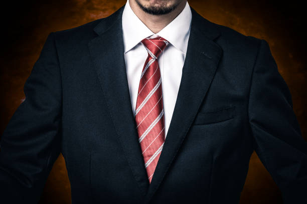 Businessman with red tie on dark background