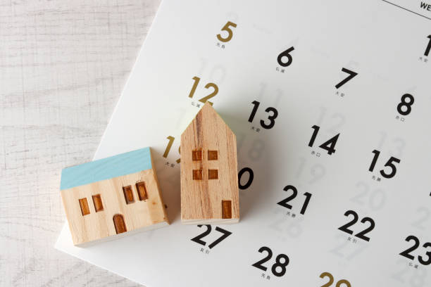 istock Two house models and a calendar 1363196137