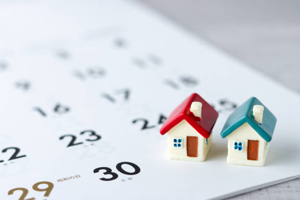 istock Two house models and a calendar 1363196157