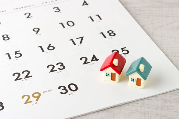 istock Two house models and a calendar 1363196158