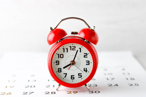 istock Red alarm clock and calendar 1363196195