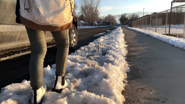 Girl walking by school during winter
