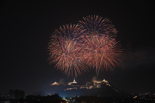 Beautiful Huge firework over Khao Wang palace ,Phra Nakhon Khiri Historical Park, Petchaburi, Thailand. Celebration Firework over mountain