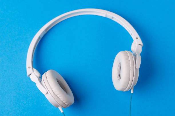 istock White headphones and blue background 1363199008