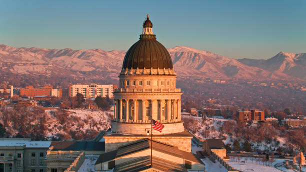 istock Stars and Stripes Waving Over Utah State Capitol Building 1363199084