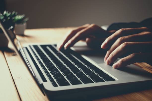 istock Man's hand typing on laptop 1363199723