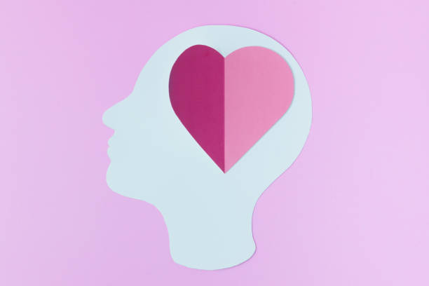 istock Human head and heart symbol on pink background. concept Fallen in love, Romantic feeling. 1363204955