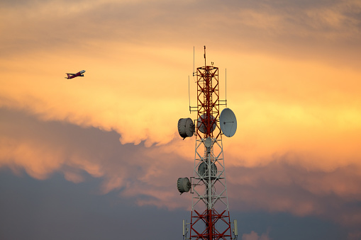 Telecommunication towers in the setting sun.