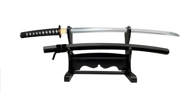 Japanese sword on double  display stand on white background