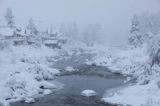 Truckee in Snow Storm The town of Truckee experience near white-out conditions in the midst of a severe blizzard. Fresh snow falls onto houses and trees that line the Truckee River, California truckee river photos stock pictures, royalty-free photos & images