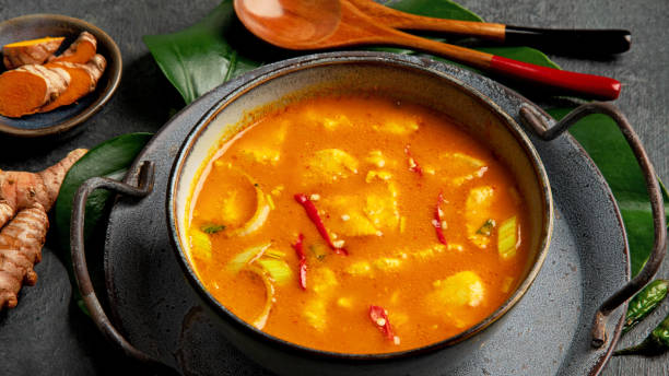 istock Yellow curry with chicken in bowl on dark background. 1363217453