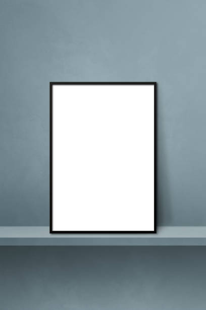istock Black picture frame leaning on a grey shelf. 3d illustration. Vertical background 1363222171