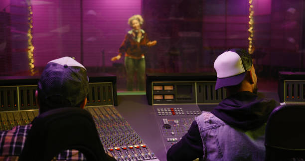 istock Men listening to music in recording studio 1363223359