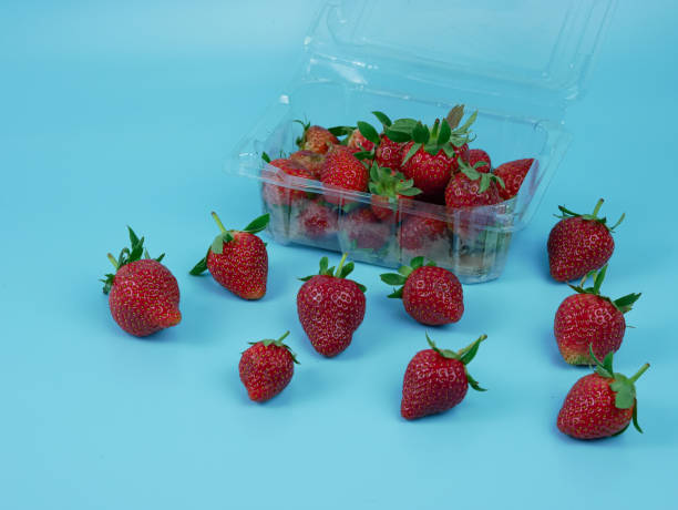istock Strawberries on a blue background. healthy and vegetarian fruit concept 1363226396