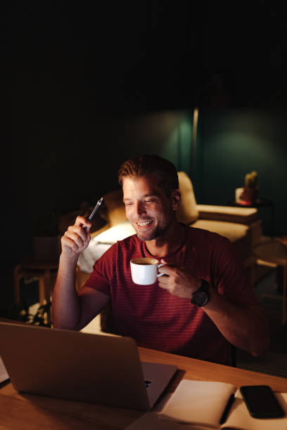 istock Happy Businessman Working on a Laptop Computer at Night 1363227298